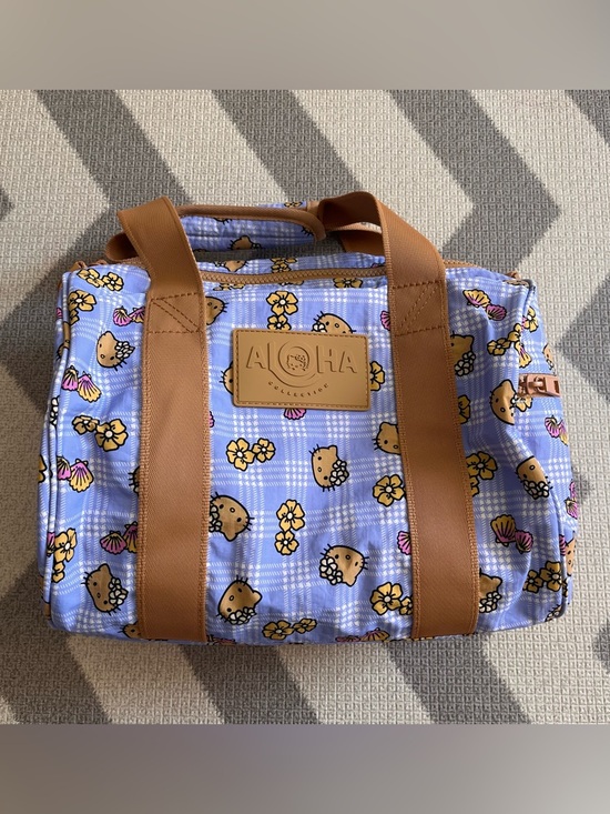 ALOHA Collection Handbags - Aloha Collection X Hello Kitty stubby duffle bag in periwinkle palaka